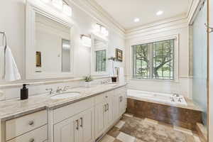 Bathroom featuring double vanity, a garden tub, recessed lighting, and light tile patterned floors