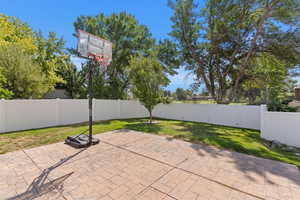 Fenced backyard featuring a patio