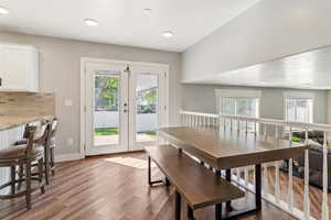 Dining space with light wood-style flooring and french doors