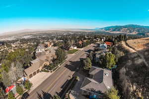 Aerial perspective of suburban area with a mountain backdrop