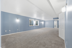 Spare room with carpet floors and baseboards