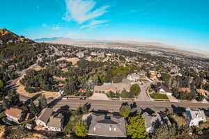 Aerial view of property's location featuring mountains and nearby suburban area