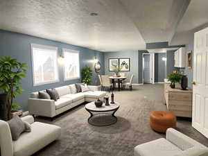 Living room featuring carpet and a textured ceiling