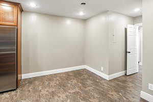 Spare room featuring recessed lighting and electric panel