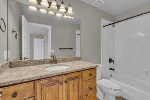 Bathroom featuring bathing tub / shower combination and vanity
