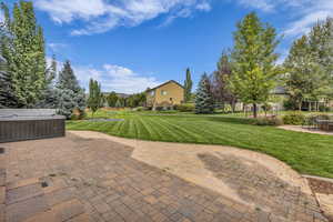 View of patio / terrace with a hot tub