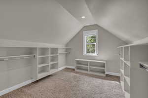 Additional living space with light carpet, lofted ceiling, and recessed lighting