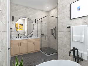Bathroom featuring tile walls, a shower stall, double vanity, and a freestanding bath