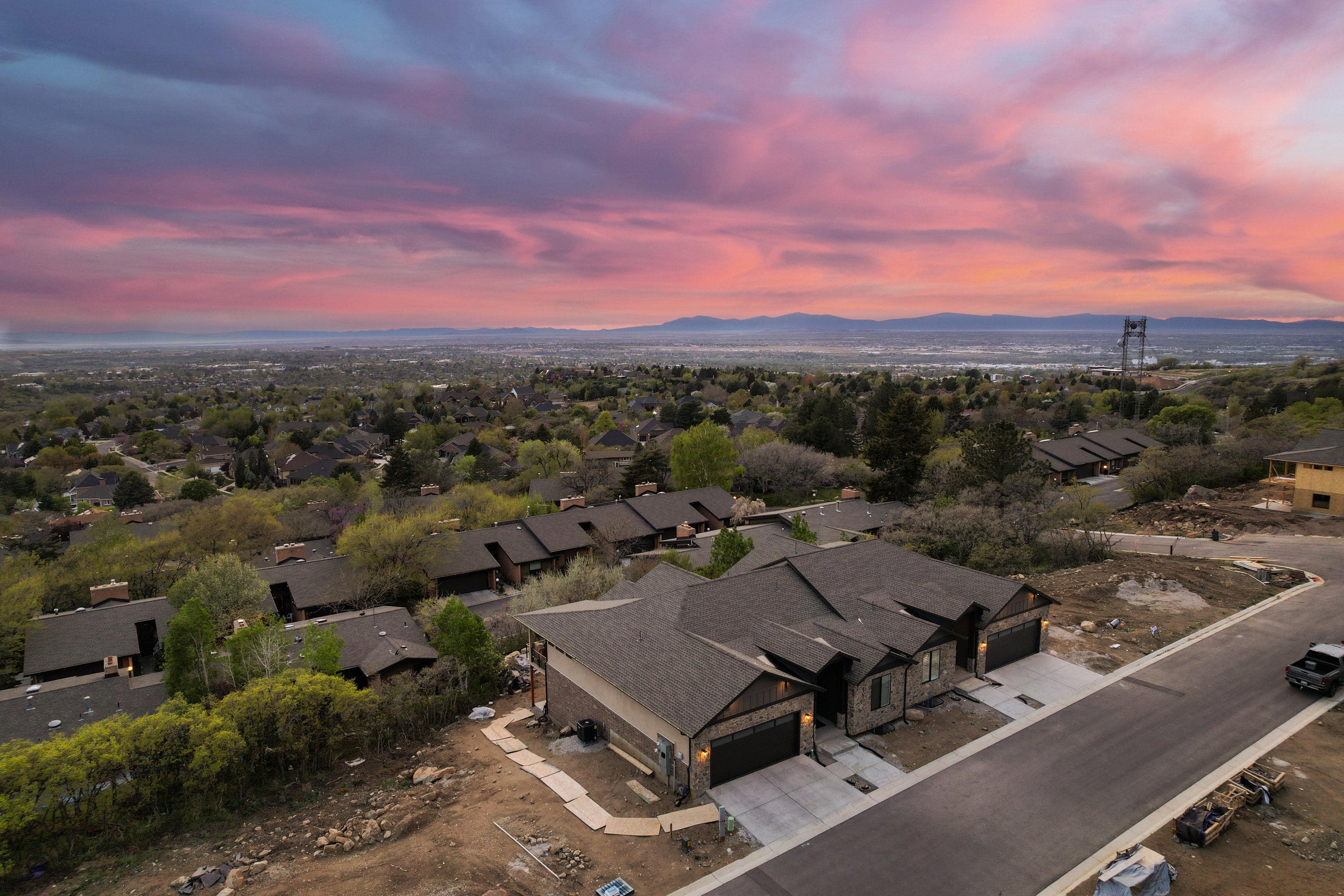 Aerial overview of property's location with nearby suburban area and mountains