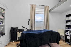 Bedroom with light wood-style floors
