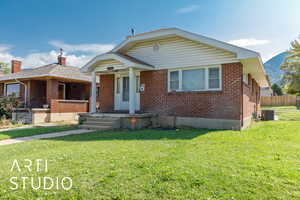 Bungalow with brick siding