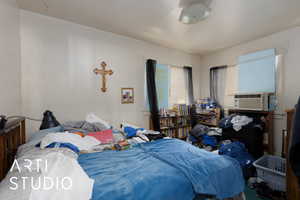 Bedroom featuring cooling unit