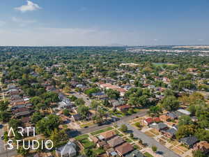 Aerial view of property's location with nearby suburban area