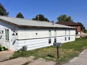 View of home's exterior featuring a yard