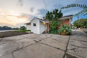 View of side of home featuring a cooling unit