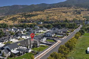 View of property location featuring a mountainous background and nearby suburban area