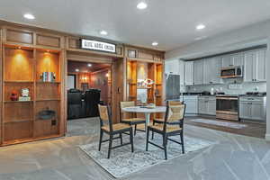 Dining room featuring recessed lighting, a textured ceiling, and dark carpet