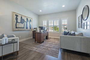 Office area featuring wood finished floors and recessed lighting