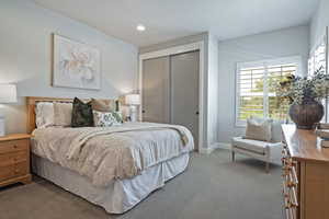 Carpeted bedroom featuring a closet and recessed lighting