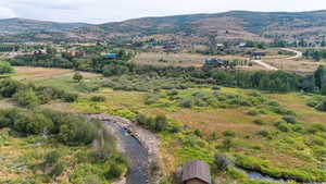 Aerial view of sparsely populated area featuring a mountainous background