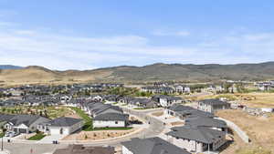 Aerial perspective of suburban area featuring a mountainous background