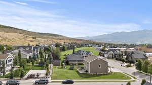 Aerial perspective of suburban area with a mountain backdrop