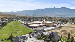 Aerial perspective of suburban area featuring a mountain backdrop