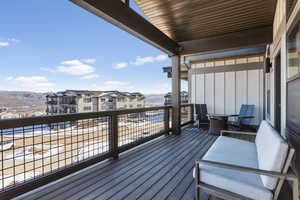 Wooden deck featuring a mountain view
