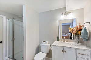 Basement 3/4  bathroom with a shower stall and vanity.  Part of possible ADU