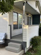 View of property exterior featuring covered porch