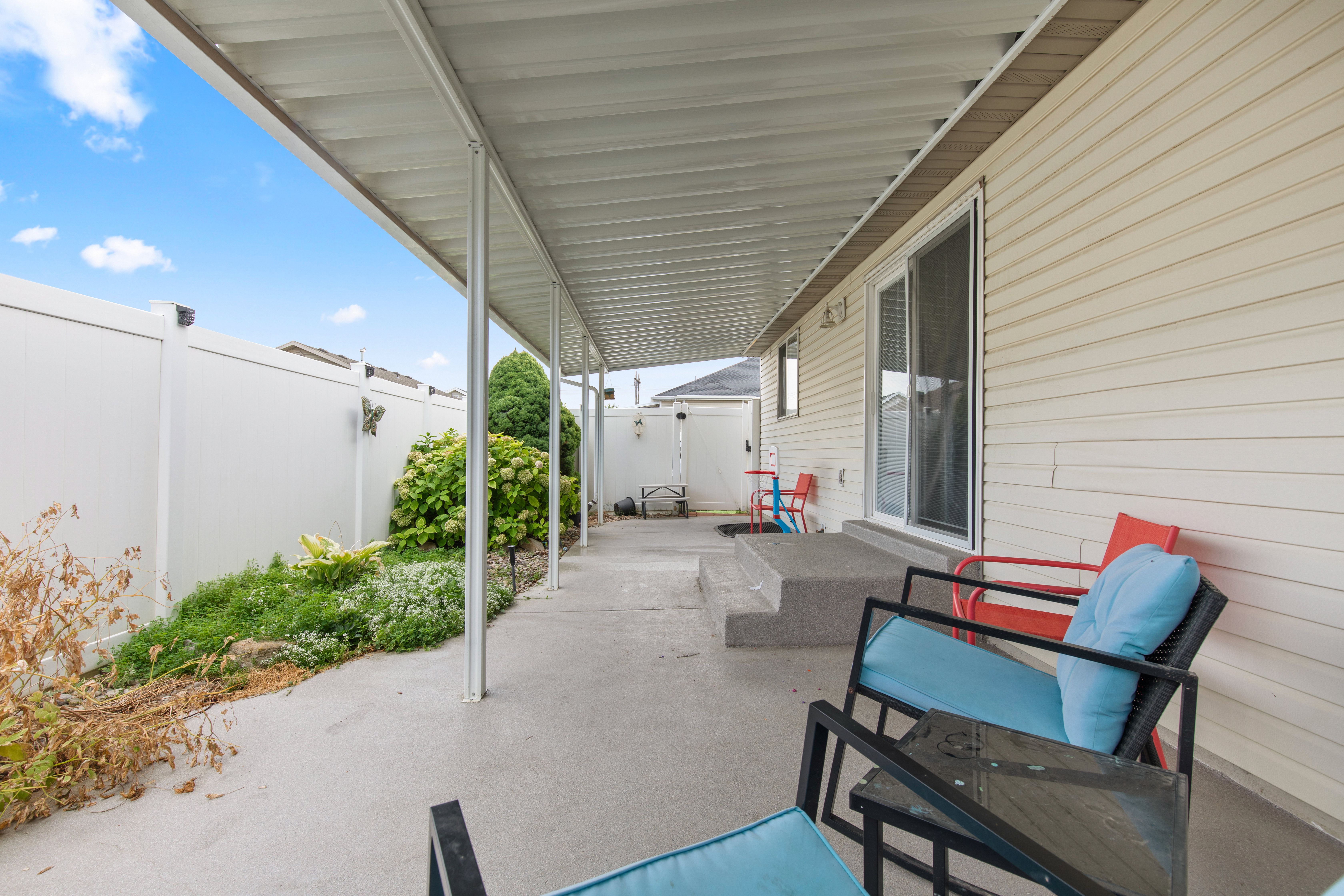 Fenced backyard featuring a patio