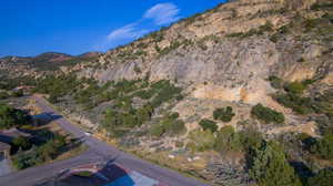 Aerial overview of property's location featuring a mountainous background