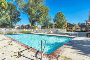 Community pool with a patio area