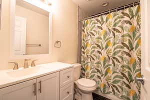 Full bath featuring vanity and a shower with curtain