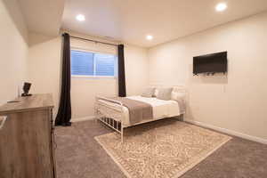 Bedroom featuring carpet flooring and recessed lighting