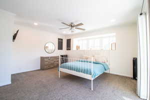 Bedroom with carpet floors, ornamental molding, a ceiling fan, and recessed lighting