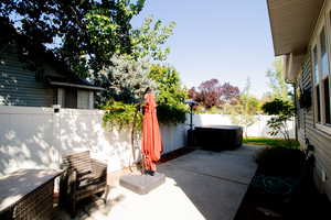 Fenced backyard with a patio area
