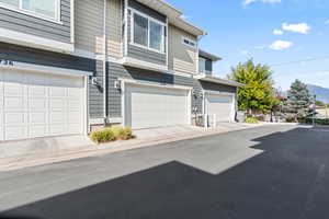 View of front facade featuring an attached garage and a mountain view