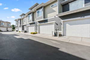 View of asphalt road featuring a residential view