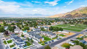 Aerial perspective of suburban area featuring a mountain backdrop