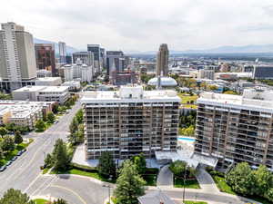 View of urban area featuring a pool area and a mountainous background