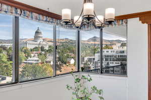 Dining room with a mountain view and a chandelier
