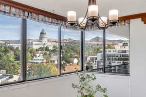 Dining room with a mountain view and a chandelier
