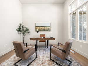 Office space featuring wood finished floors
