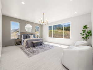 Carpeted bedroom featuring a chandelier and recessed lighting