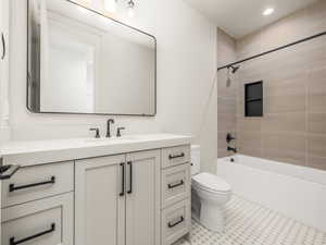 Full bath with vanity,  shower combination, and recessed lighting