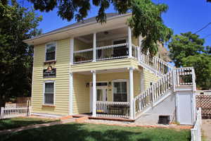 View of front of house with a porch and stairway