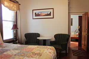 Bedroom featuring dark wood-style flooring