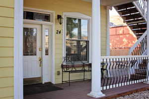 Entrance to property with a wooden deck