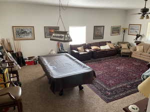 Playroom featuring billiards table, carpet floors, a textured ceiling, and ceiling fan